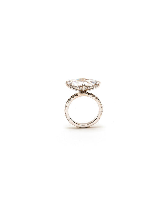Silver ring with a diamond on a white background