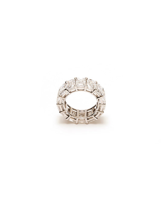 Silver ring with embedded diamond stones on a white background