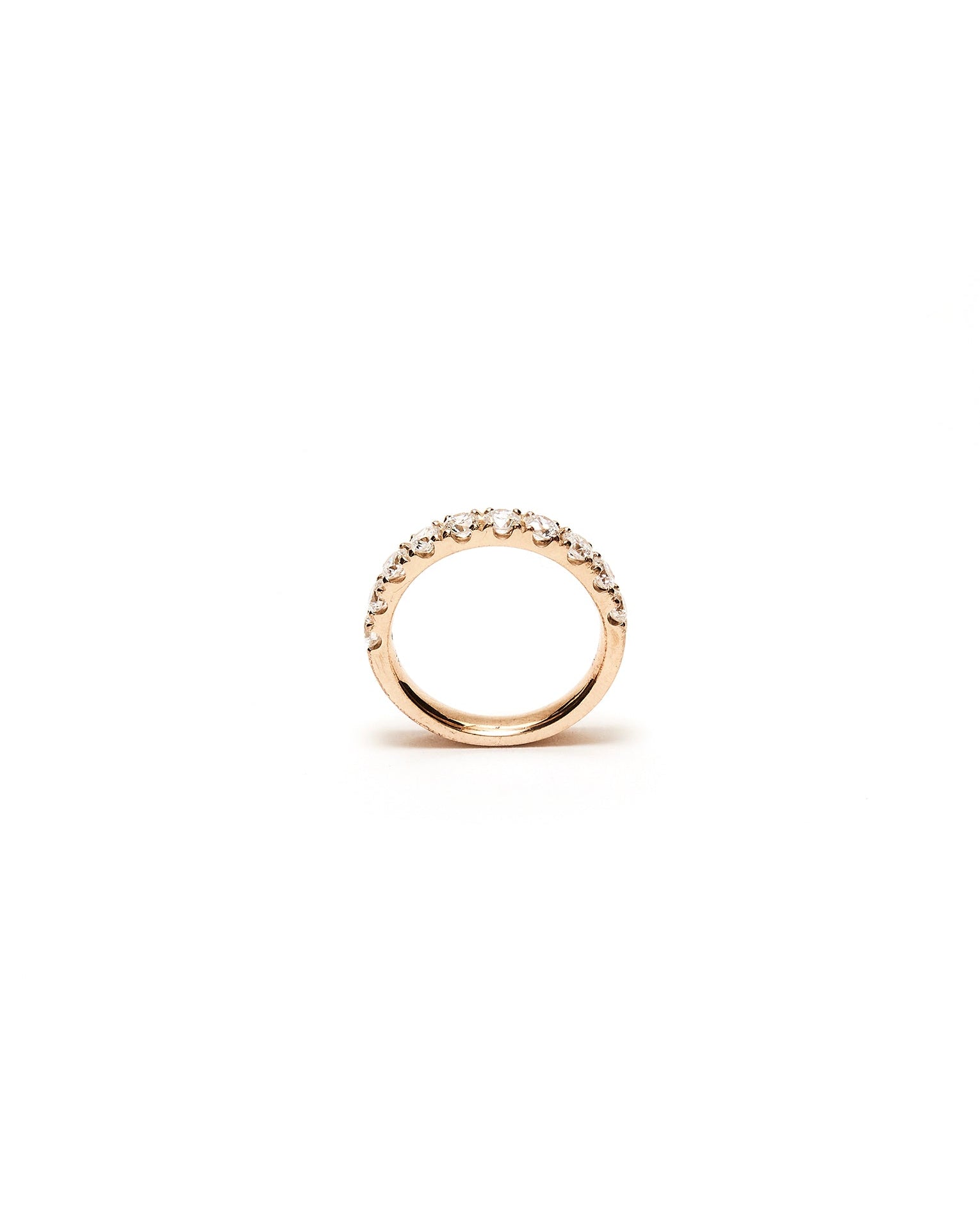 Gold ring with diamond small stones on a white background