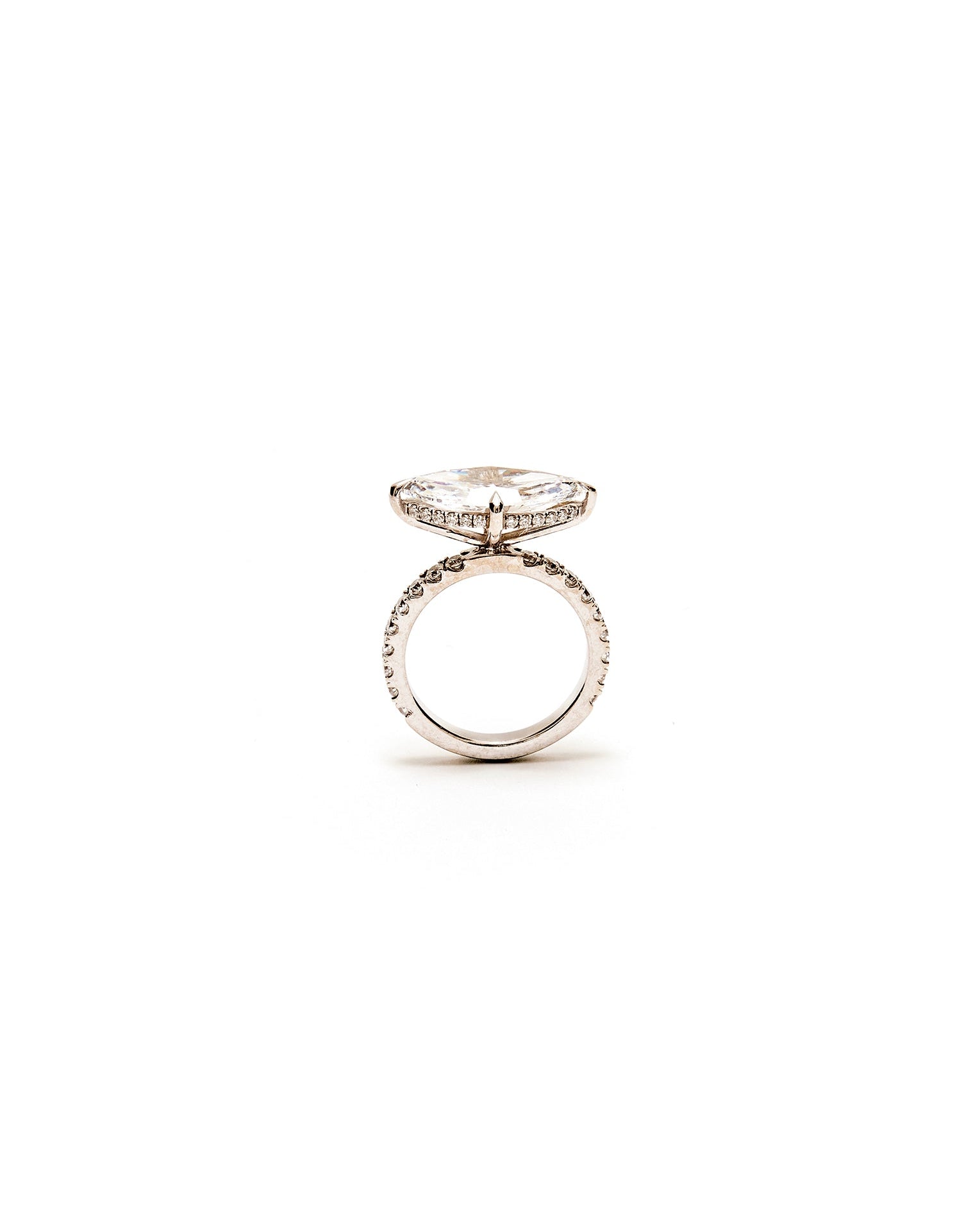 Silver ring with a diamond on a white background
