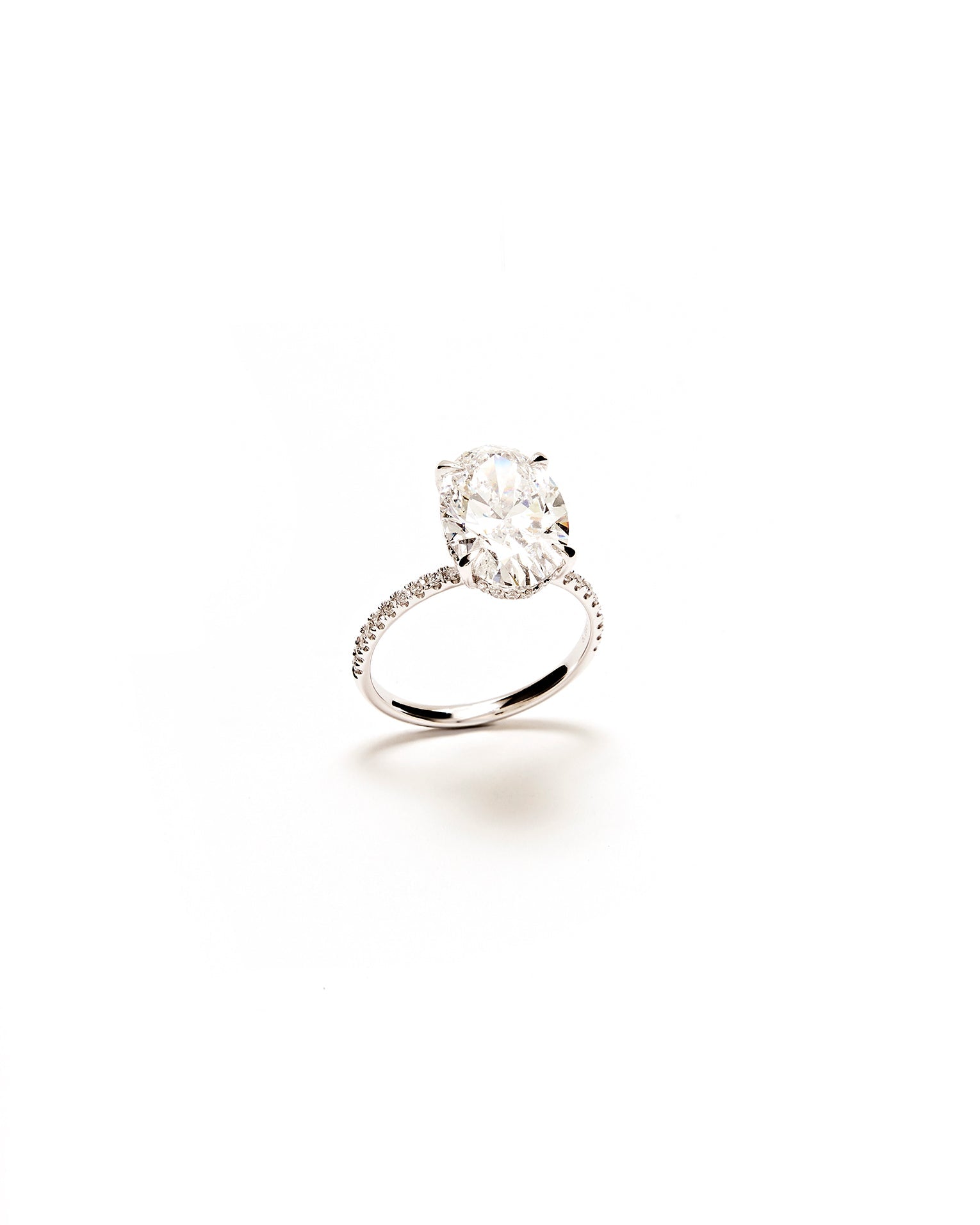 round diamond silver ring on a white background